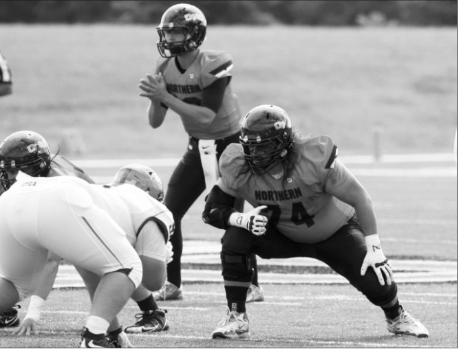 Freshman quarterback Will Freed calls out signals before the snap in Saturday's 29-22 Polar Bear victory. (photo/ONU Sports Information)