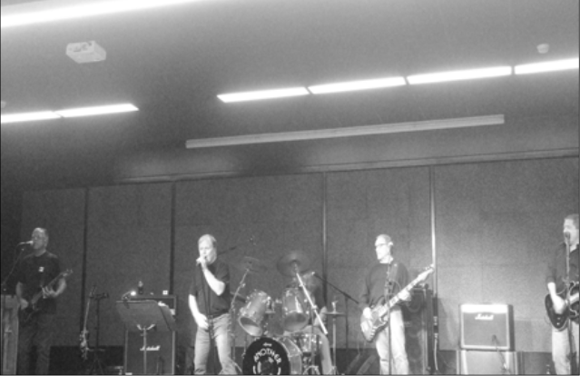 Another Round rocks the stage (Northern Review photo/Dana Zechar).