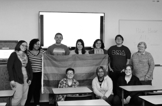 Open Doors Ally Group Photo with the rainbow flag after the meeting. (Northern Review phot/Jennifer Kolb)