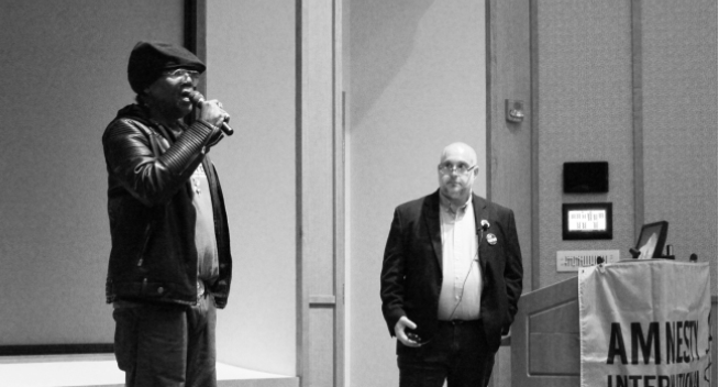 Derrick Jamison, death row exoneree, and Abraham Bonowitz, Ohioans to Stop Executions' Representative, speak at the presentation (Northern Review photo/Holly Dyer)
